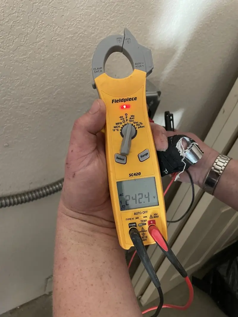Voltage testing with clamp meter during Electrical Installation Services in Mascoutah